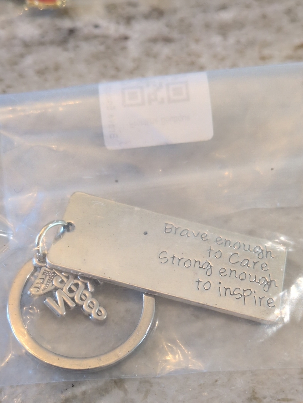 Inspirational  RN Silver Tone Keychain - "Brave enough to care"
